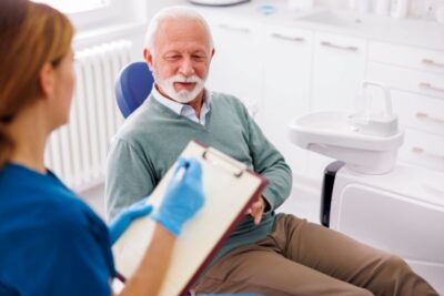 Senior man attending dental checkup.